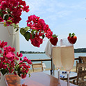 Red flowers and champagne glasses adorned with strawberries