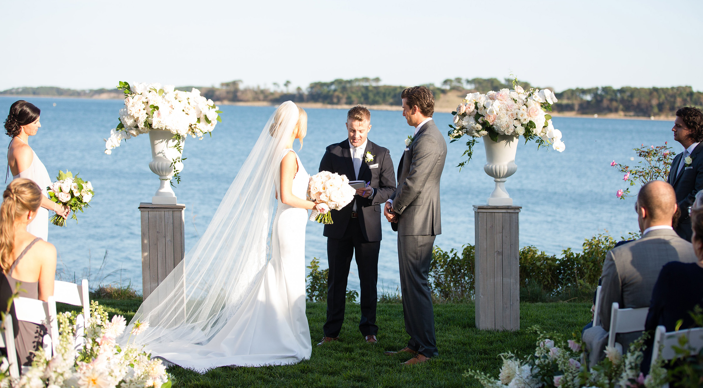 Bride and groom exchange vows at Cape Cod waterfront venue