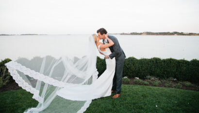 Wedding couple kiss on Cape Cod waterfront
