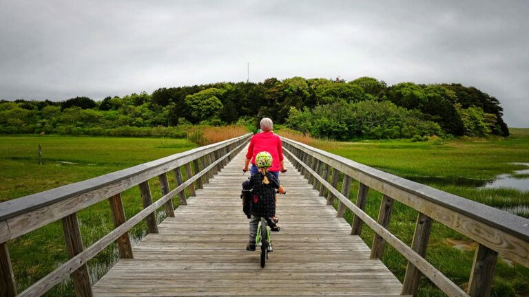 Biking along wooden plank bridge
