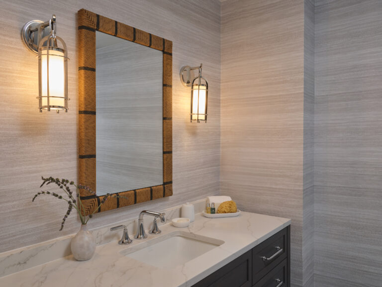 Elegant marble vanity with warm lighting and natural textures