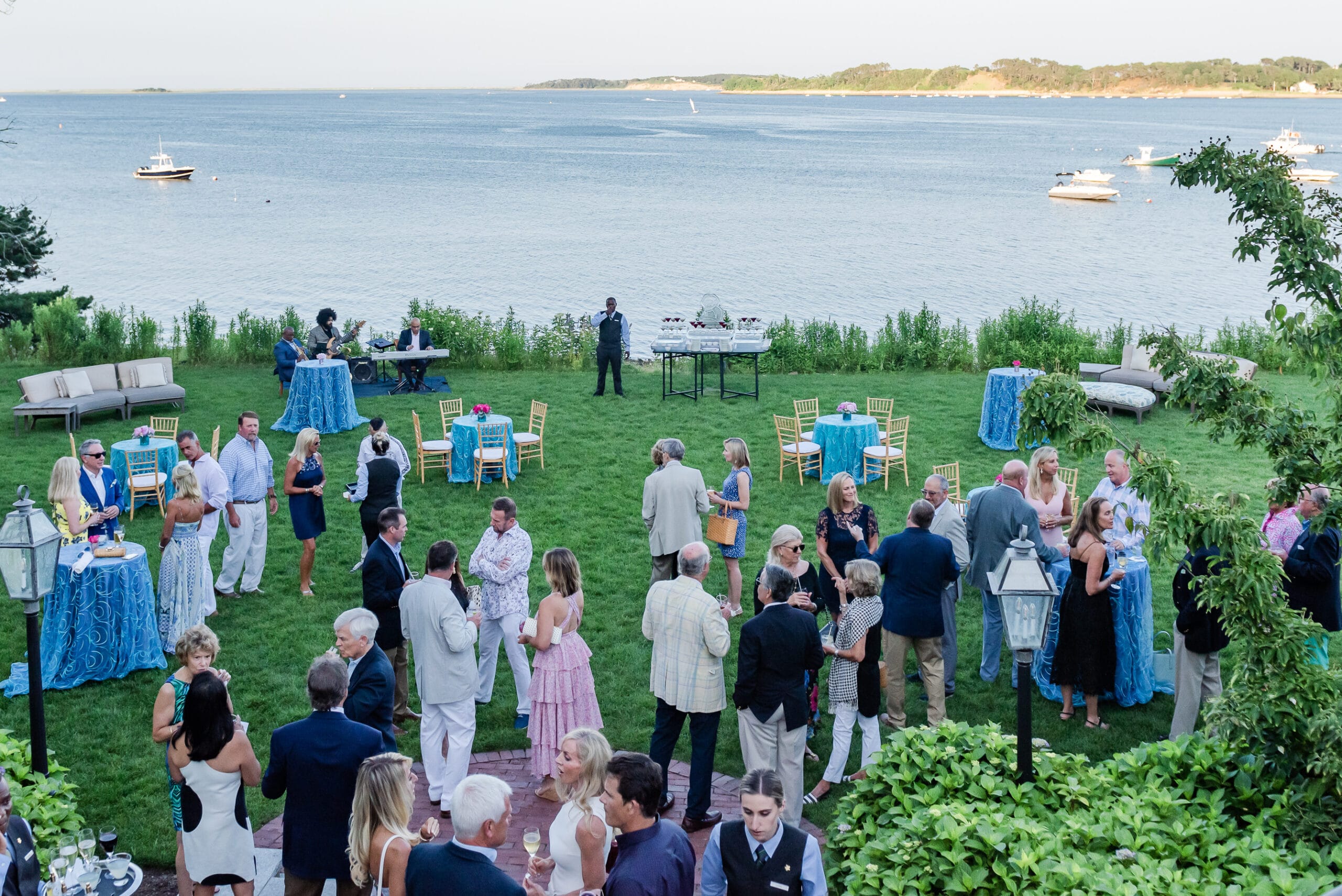 Wedding guests mingling outside.