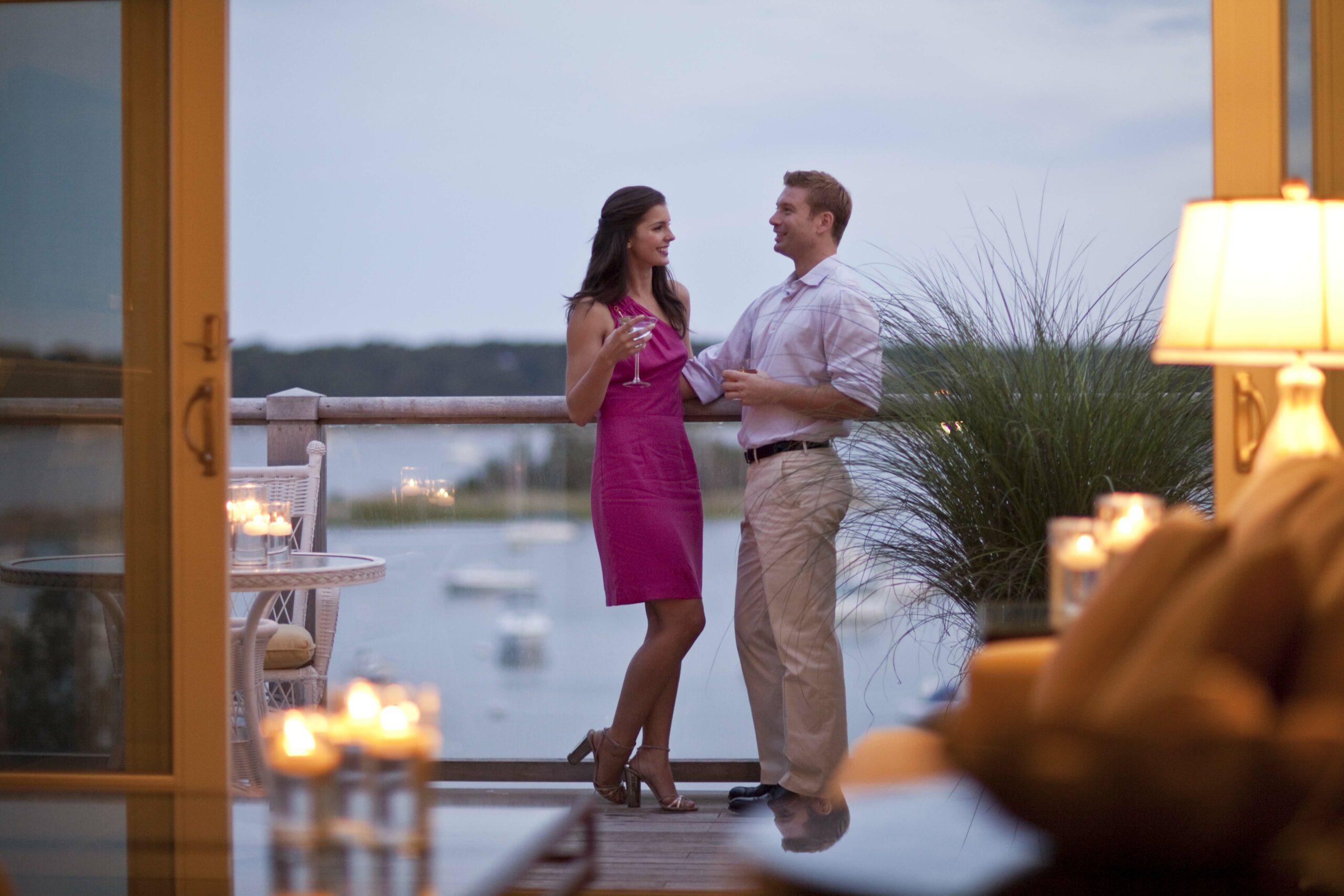 A couple enjoying a romantic night with wine.