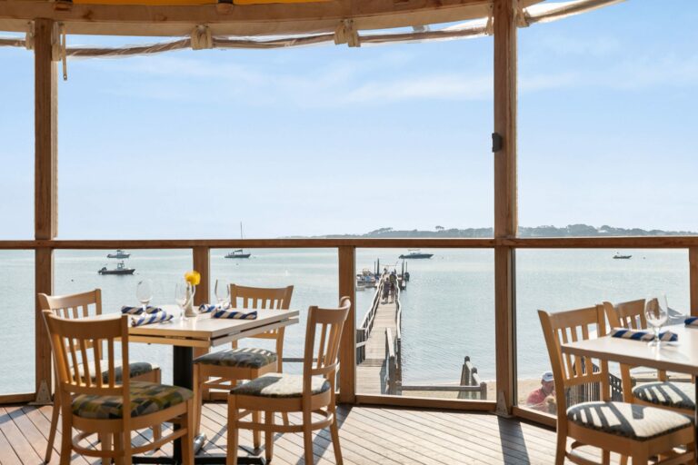 Outdoor dining at the Outer Bar and Grille overlooking the ocean on Cape Cod.