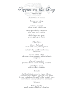 Enjoy Supper on the Bay with an elegant dinner menu featuring seafood hors d’oeuvres, flatbread, shrimp salad, broccolini, and a main course with shellfish, pasta, and a peach mousse dessert.