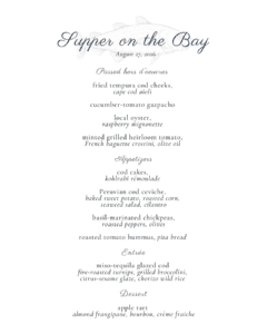 A printed menu titled "Supper on the Bay" showcases a selection of seafood-focused hors d’oeuvres, appetizers, entrées, and desserts for an event scheduled on August 27, 2026.