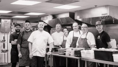 Group of chefs in a kitchen.