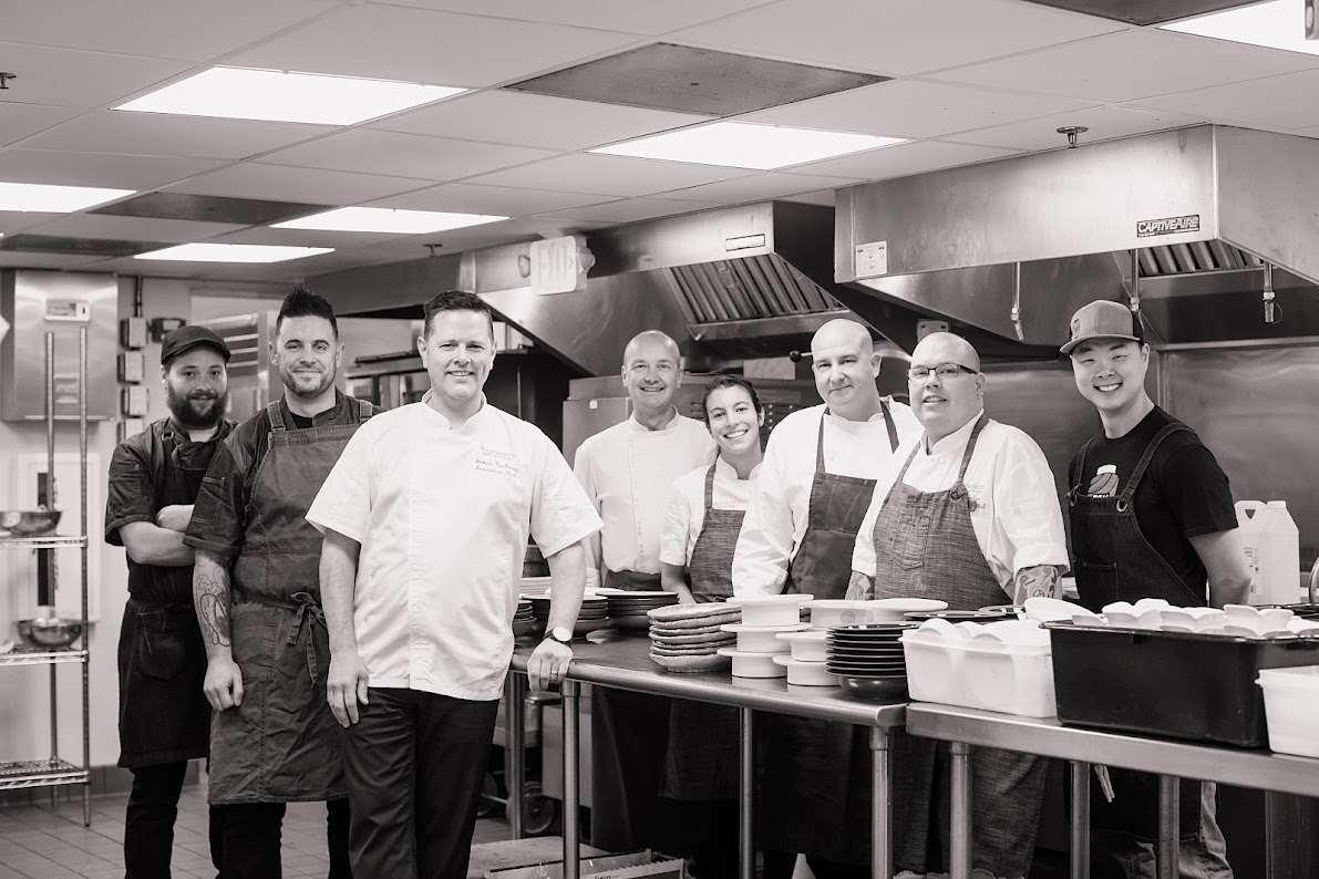 Group of chefs in a kitchen.