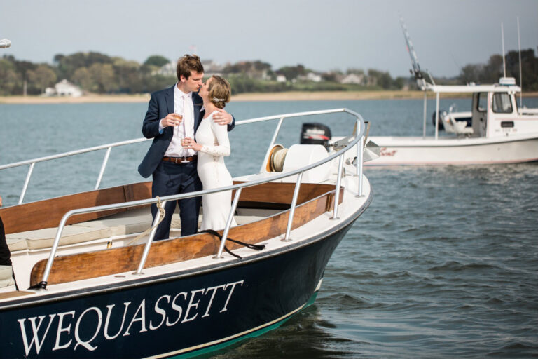 A couple sharing a kiss on a boat.