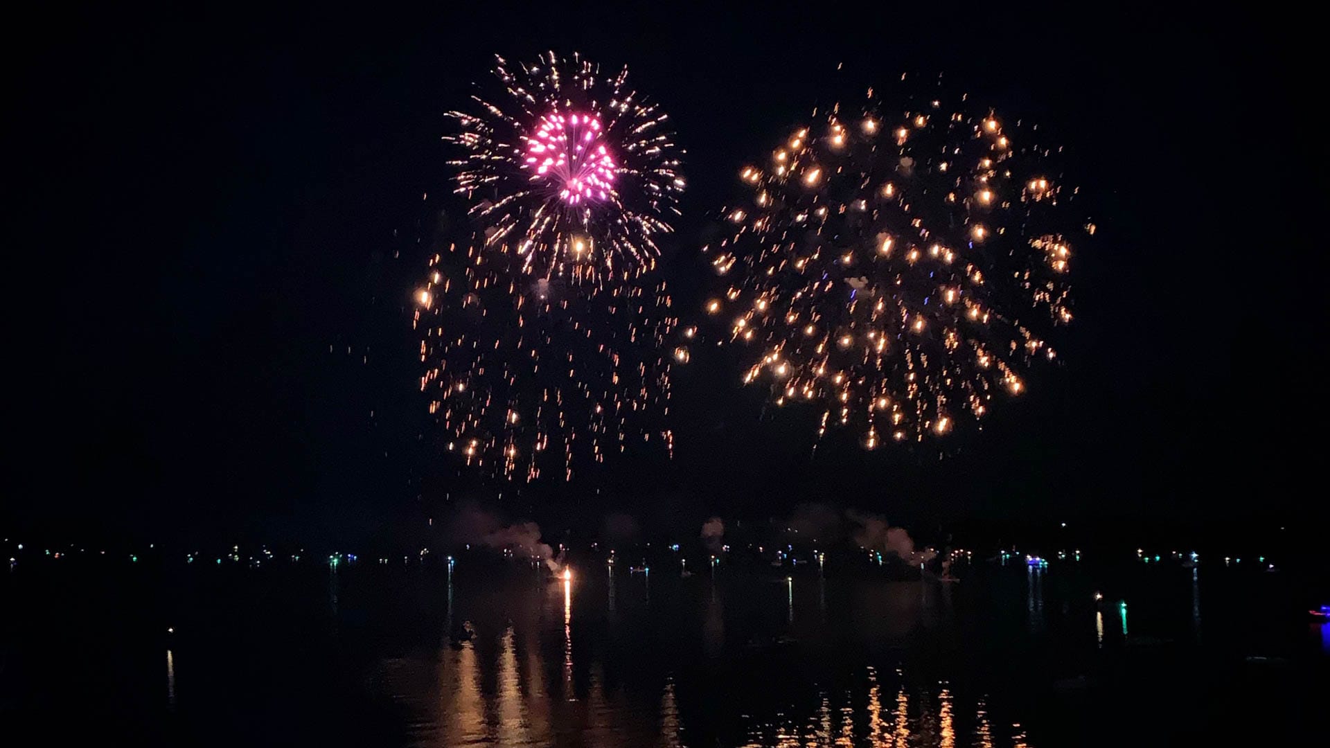 Fireworks over the water.