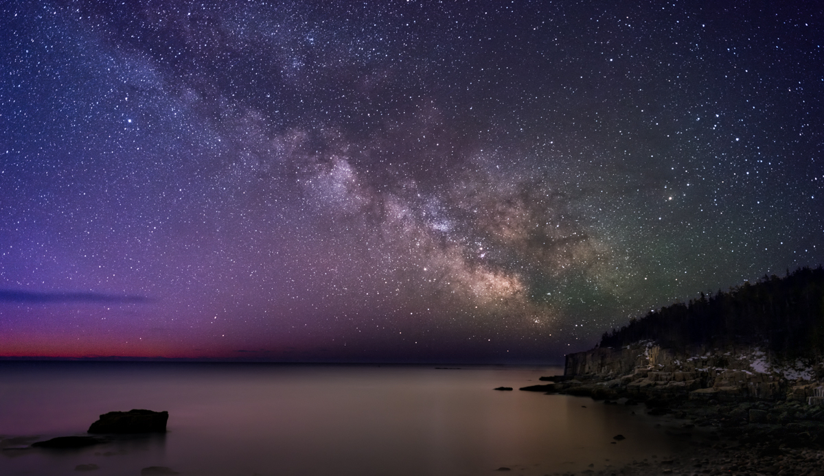Night sky over the Cape Cod ocean with many stars
