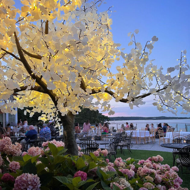 An outdoor dining area with flowers.